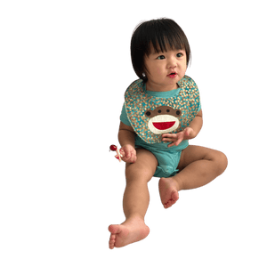 Baby Bib with Happy Monkey on Batik in Tidepool Teal