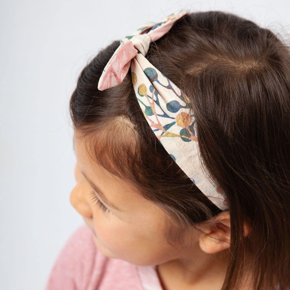 Kids reversible handsewn head bands in colorful batiks by Forai artisans
