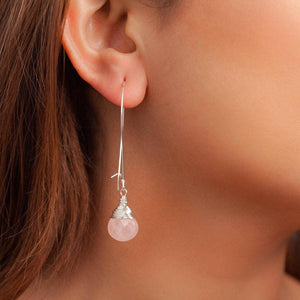 Teardrop rose quartz earrings in sterling silver. Forai refugee made gifts. Fashion for good.