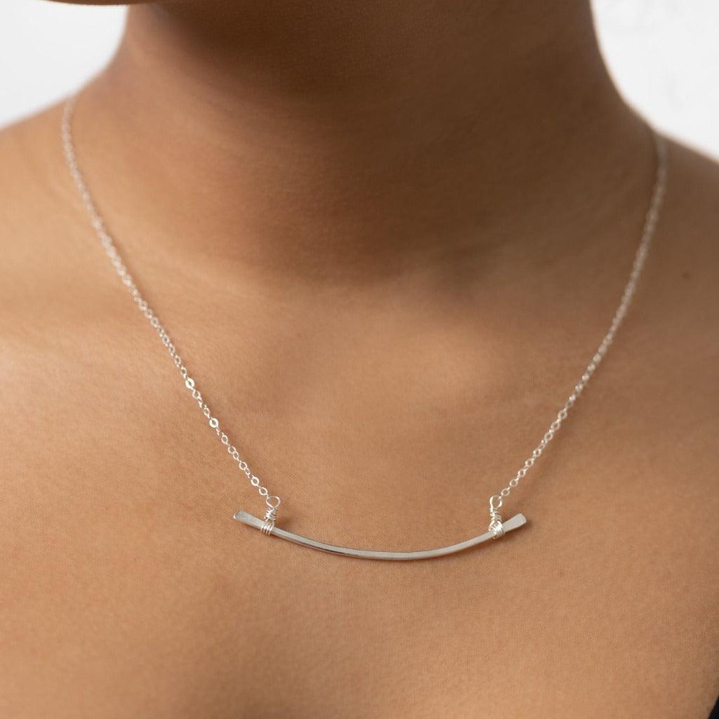 Sterling silver minimalist hand hammered bar necklace. Forai refugee handmade gifts. Fashion for good.